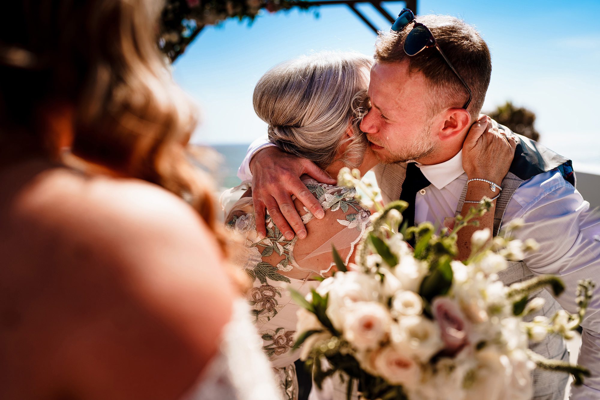 candid wedding photography of groom crying in wedding ceremony