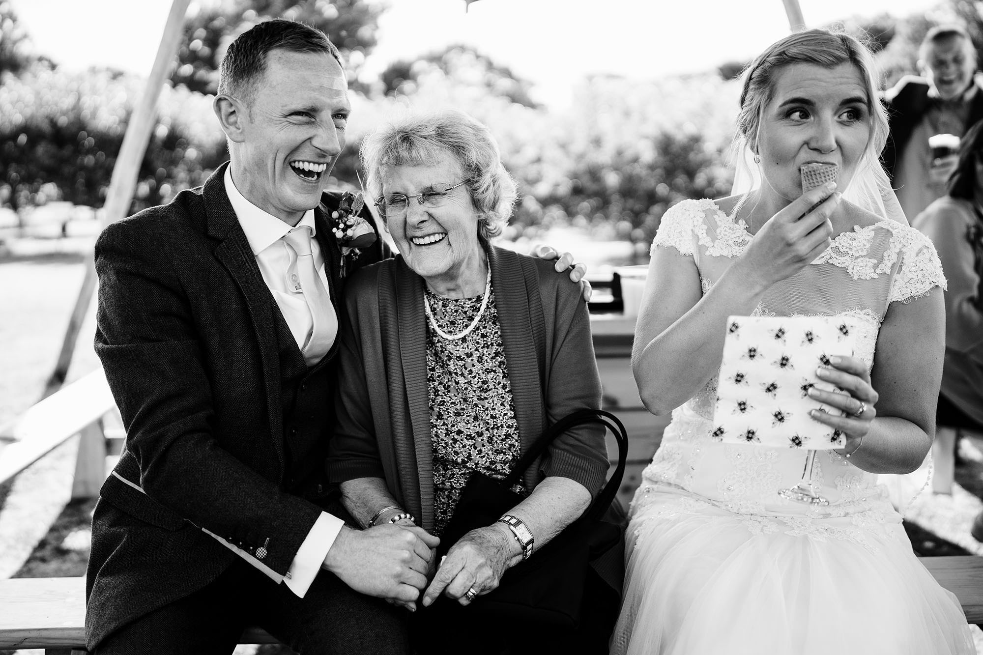 outdoor cotswolds wedding with bride eating ice cream