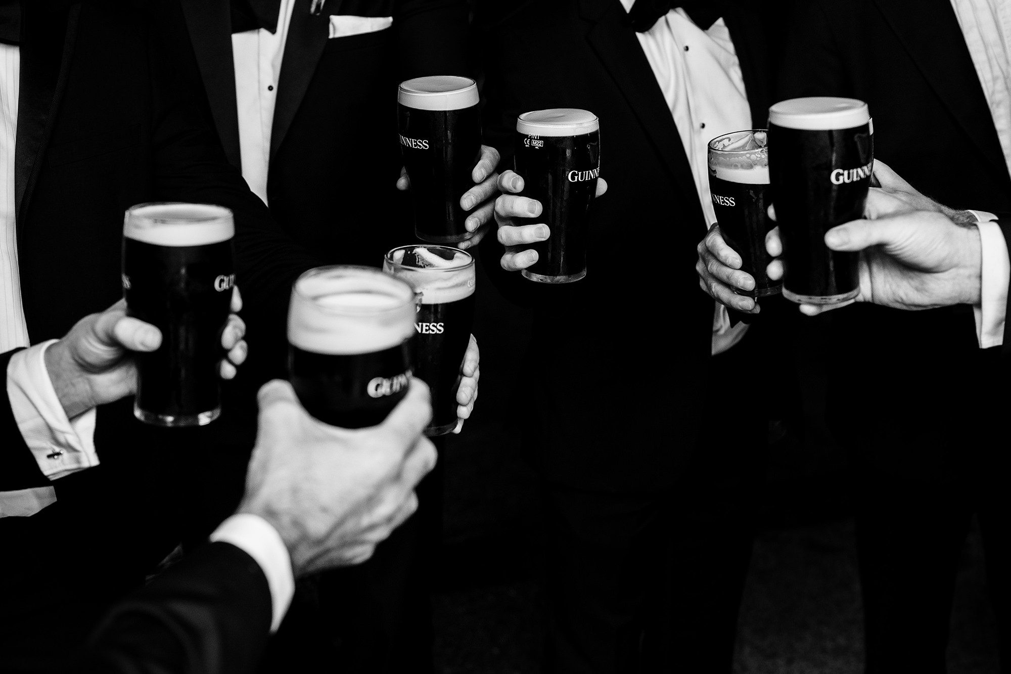 Guinness and groomsmen at destination wedding in Ireland