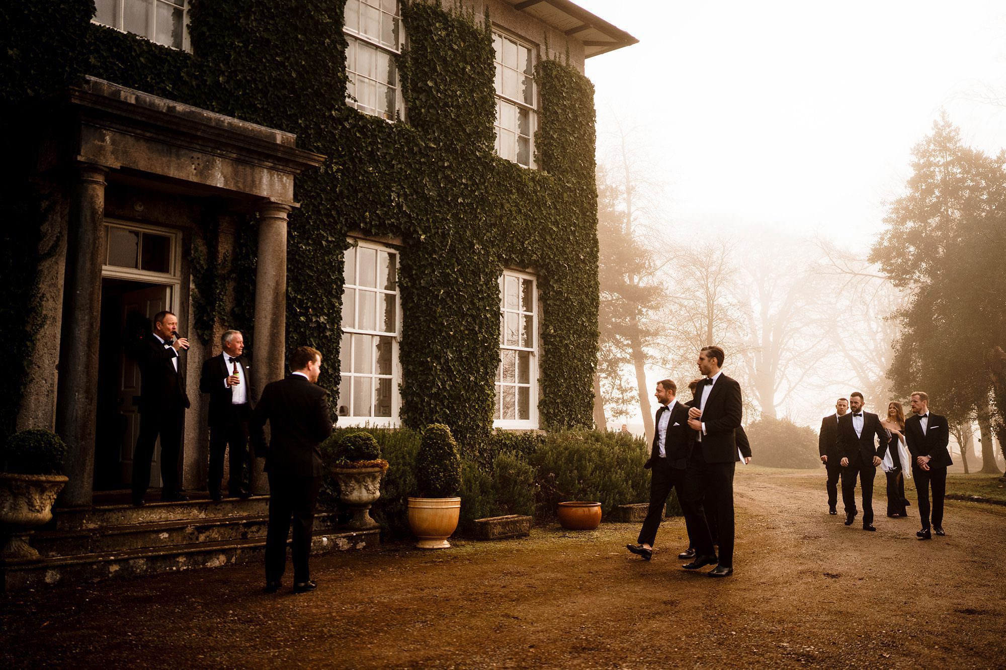 wedding guests arrive at longhand's venue in Cartmel