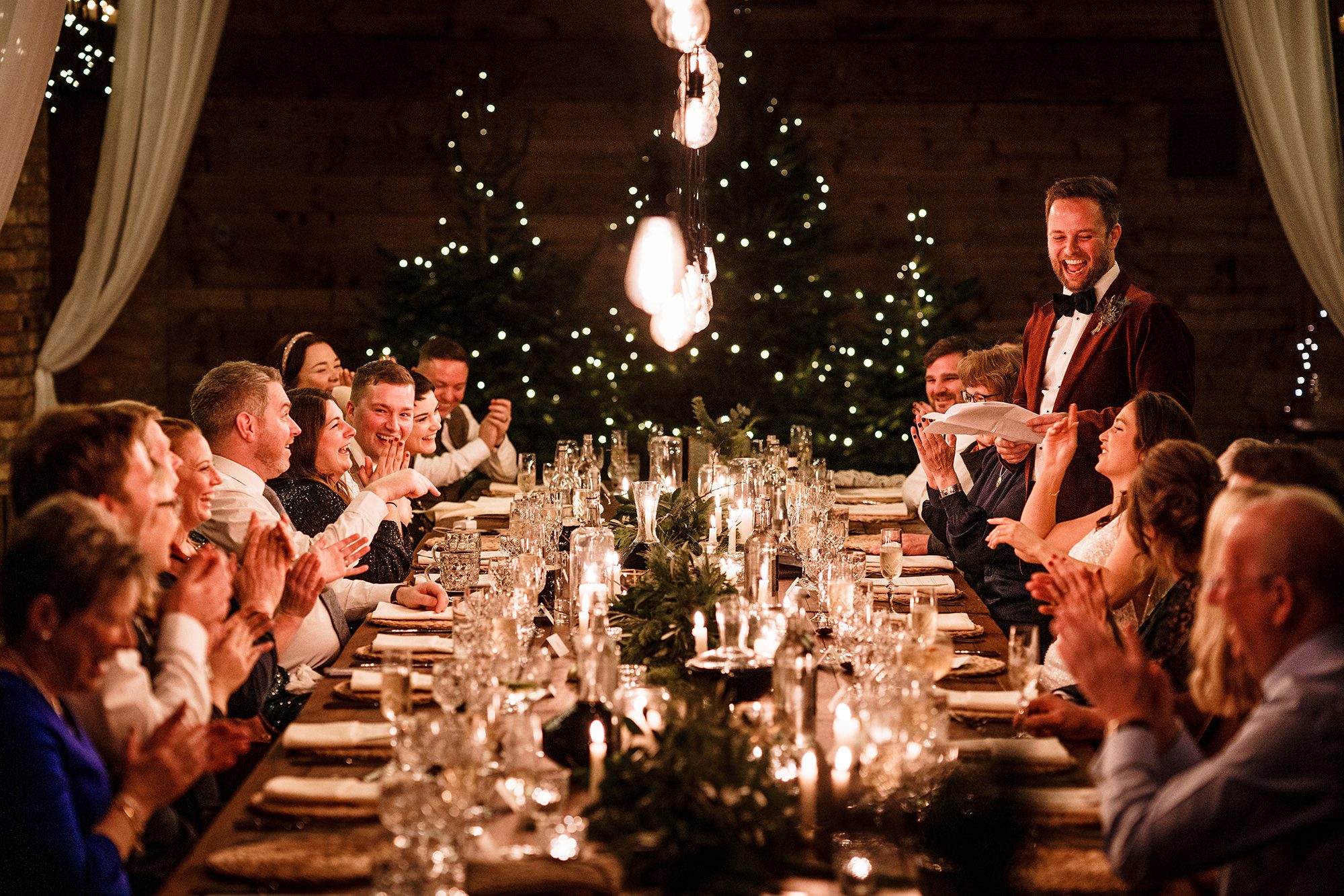 groom stands up during speech for Lake District wedding photo