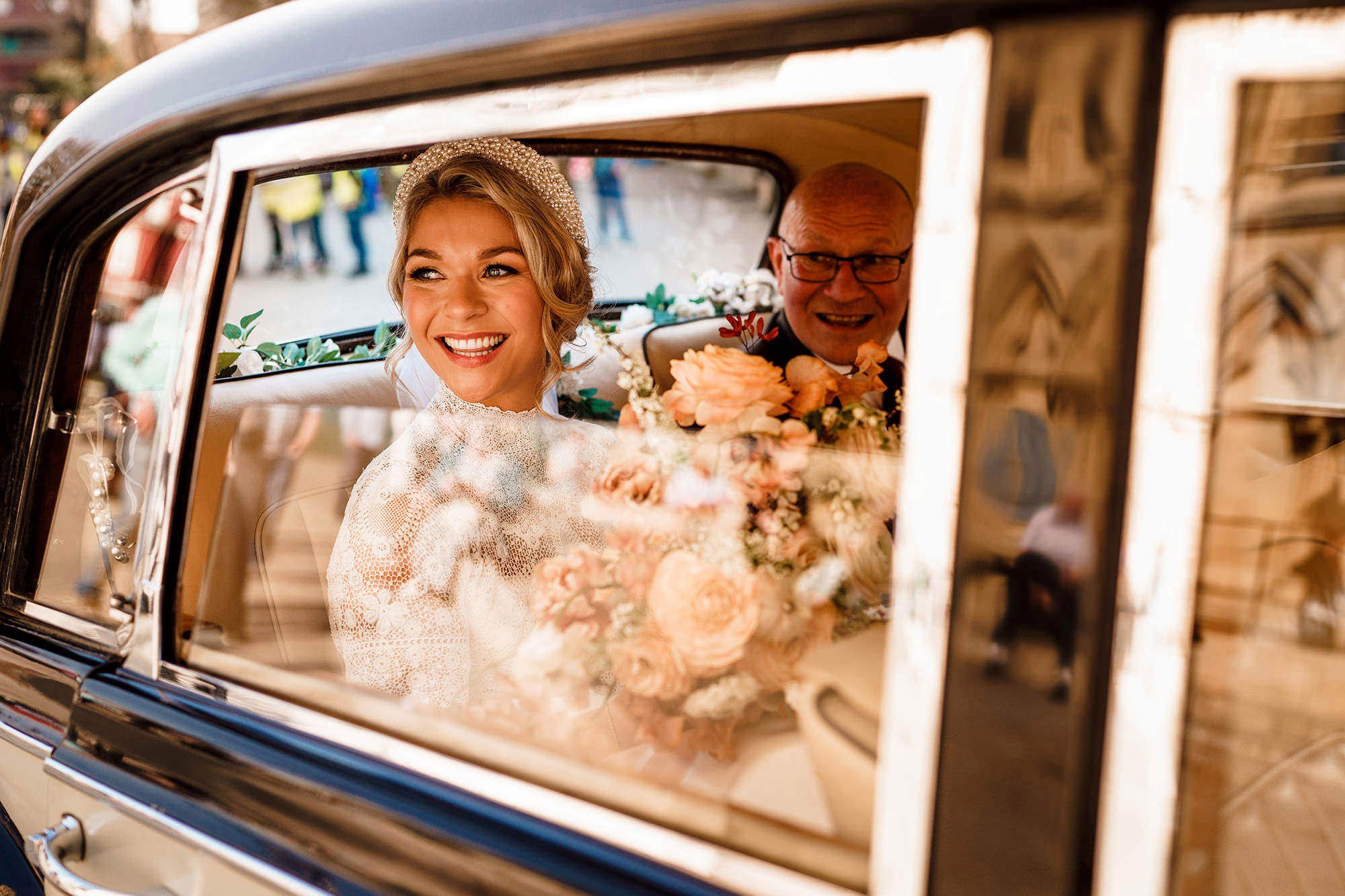 bride looks out onto lake Windermere for wedding